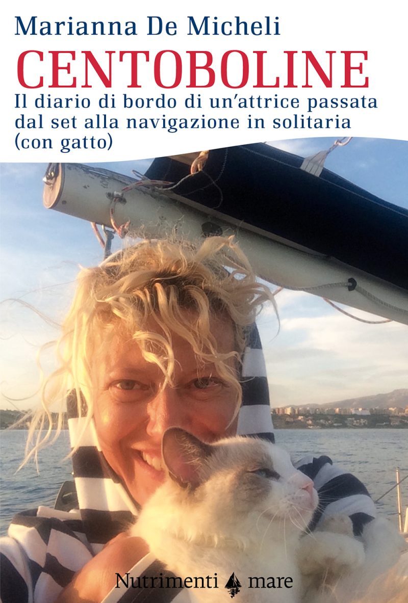 In copertina foto dell’autrice in barca con il suo gatto