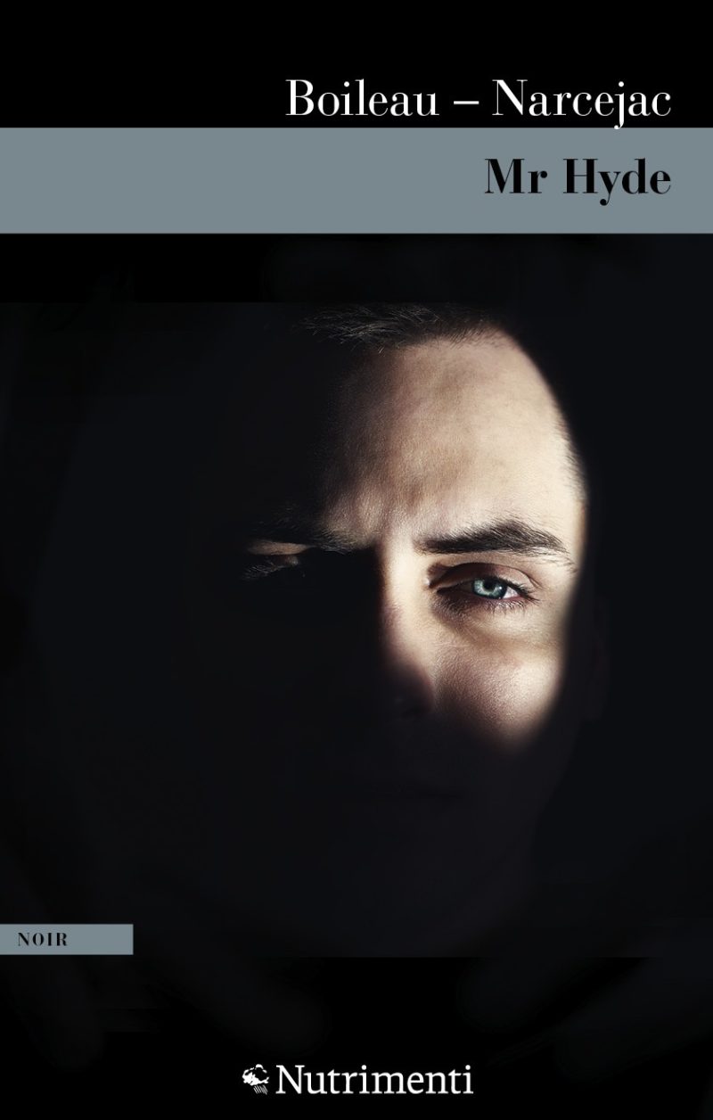 In copertina un volto di uomo che merge dall’ombra.